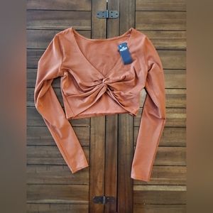 Orange holliser twist crop top